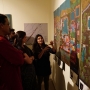 Students explaining the exhibition to the guests